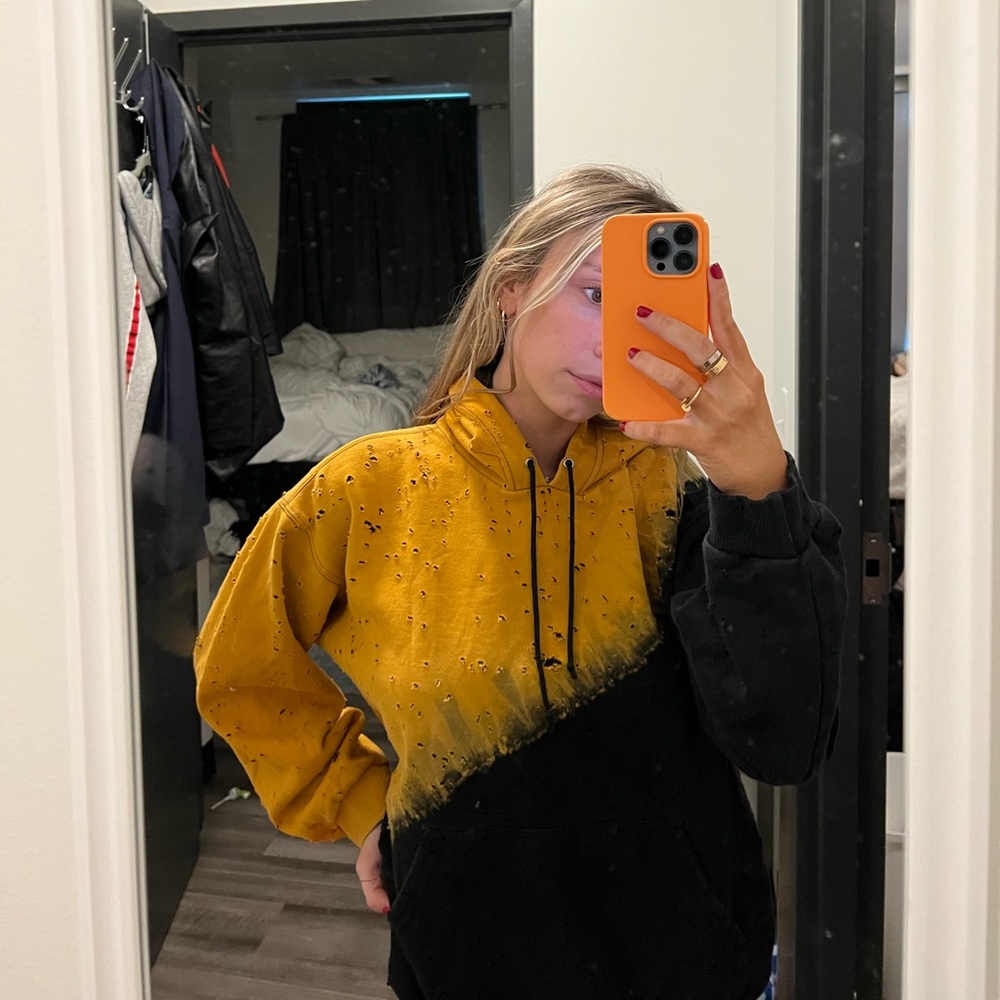 LF hoodie by Emma&Sam black and yellow with trendy rips and holes. Size small